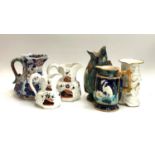 Three 19th century Ironstone jugs, one Hydra handle; together with an Aesthetic style jug with
