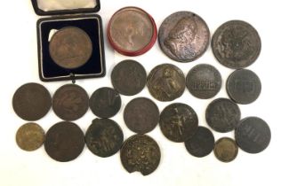 A quantity of commemorative coins and tokens to include Nelson medals struck from copper of the