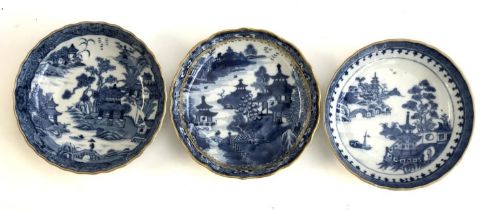Three late 18th century Chinese export blue and white dishes with clobbered gilt decoration, each