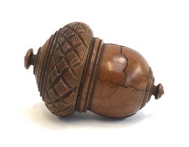 A Georgian treen coquilla nutmeg grater, in the form of an acorn, c.1800, threaded cap opening to