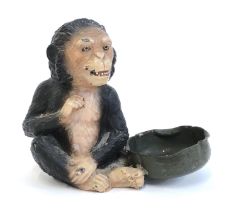 A mid 20th century painted spelter chimpanzee, 11cmH