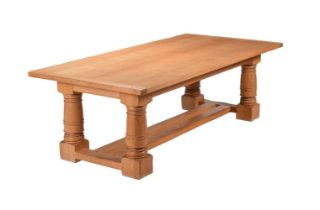 A 20th century oak refectory table in 18th century style, the top above frieze drawers to the