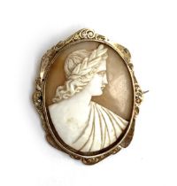 A gold mounted carved shell cameo brooch, 5cmL, gross weight 8.7g