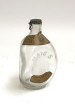 An empty Haig's whisky dimple bottle, 20cmH