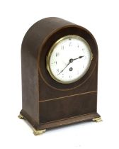 A mahogany and boxwood strung mantel clock with Parisian movement, 28cmH