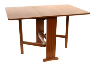 A large mid-century style drop leaf oak Sutherland table, 120cm wide (when open), 76cm deep, 74cm