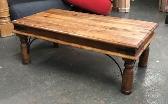An Eastern hardwood and metal banded coffee table, on turned legs, 110x61x39cmH; together with one
