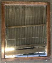 A rectangular oak mirror, with bevelled glass, 65x55cm