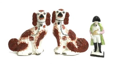 A pair of Staffordshire dogs, 29cmH (af); together with a Staffordshire Napoleon, 26cmH
