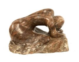 A large carved hardstone figure of a kneeling nude, 37cmL