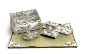 An unusual late 19th/early 20th century porcelain desk set retailed by Gilman Collamore, New York,