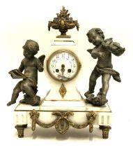 A white marble mantel clock with gilt bronze cresting, flanked by cherubs, 41cmH