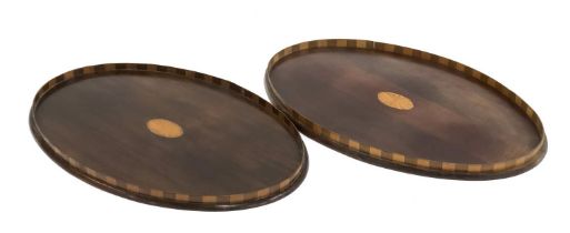 A pair of Edwardian mahogany oval trays, with chequered galleries, 56x36cm