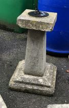 A composite stone and bronze sun dial, approx. 74cmH