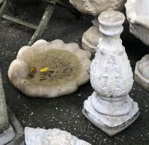 A scallop shell bird bath, together with a support