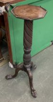 A carved mahogany torchere/pot stand, on tripod cabriole legs, 96cmH