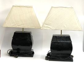 Interior design interest: a pair of decorative black lacquered papier mache table lamps, with