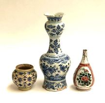 A Delft blue and white vase (af), 35cm high; together with a Japanese bottle form vase painted