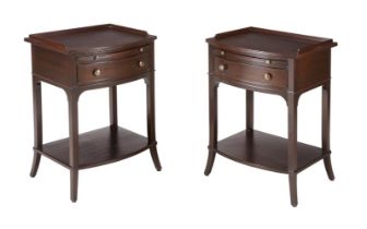 A pair of modern bowfront bedside or side tables by Thomas Pheasant for Baker Furniture, each with