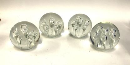 Four large glass paperweights, each approx. 12.5cmD