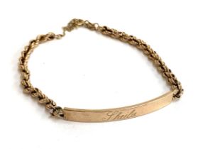 A 9ct gold bracelet with name plaque engraved 'Sheila', 5.6g