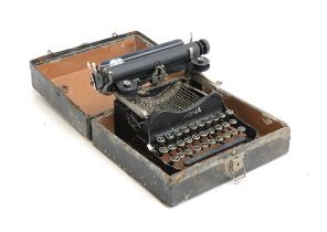 An early Corona typewriter in case; together with a Planck projector and an Ilford Elmo cine