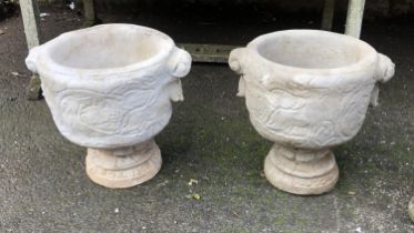 A pair of composite stone planters depicting wildlife, 45cmH