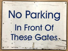 A metal sign, 'No parking in front of these gates', 59.5x45.5cm