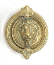 A heavy brass lion mask door knocker, 16cmL