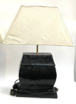 Interior design interest: a decorative black lacquered papier mache table lamp, with rectangular