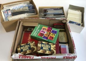 A mixed lot in 4 boxes to include definitive and commemorative stamps, presentation packs, first day