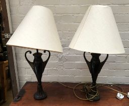 A pair of bronze urn form table lamps, with shades