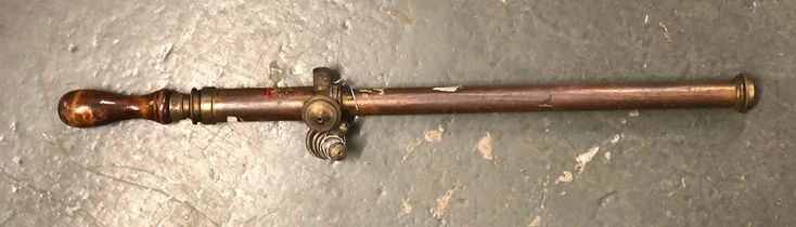 A brass and copper garden syringe/sprayer