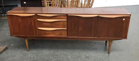 A large mid-century teak sideboard by Stonehill Furniture Ltd, having three drawers and three