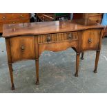 A George III style 20th century sideboard, two drawers flanked by cupboards, 153x55x87cm