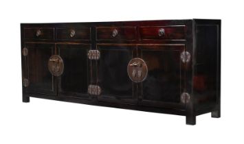 A Chinese lacquered wood side cabinet, 20th century, the top inlaid with an opium mat 86cm high,