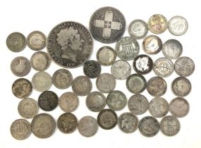 A quantity of pre 1947 silver coins to include George III crown 1819, one florin 1874, four pence