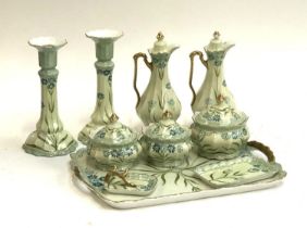 A porcelain Limoges style dressing table set, green ground with a blue floral decoration