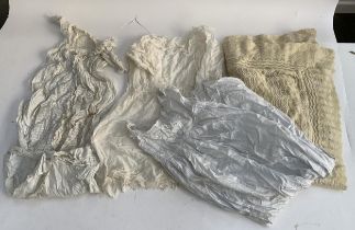 A quantity of christening dresses