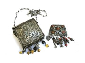 A white metal North African Quran box pendant with yellow bead tassels and star engraving, 9.5cmW;