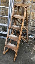 A vintage wooden stepladder