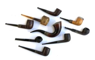 A collection of nine various silver collared smoking pipes