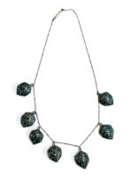 An early 20th century white metal and turquoise chip mosaic pendant fringe necklace, the pendants