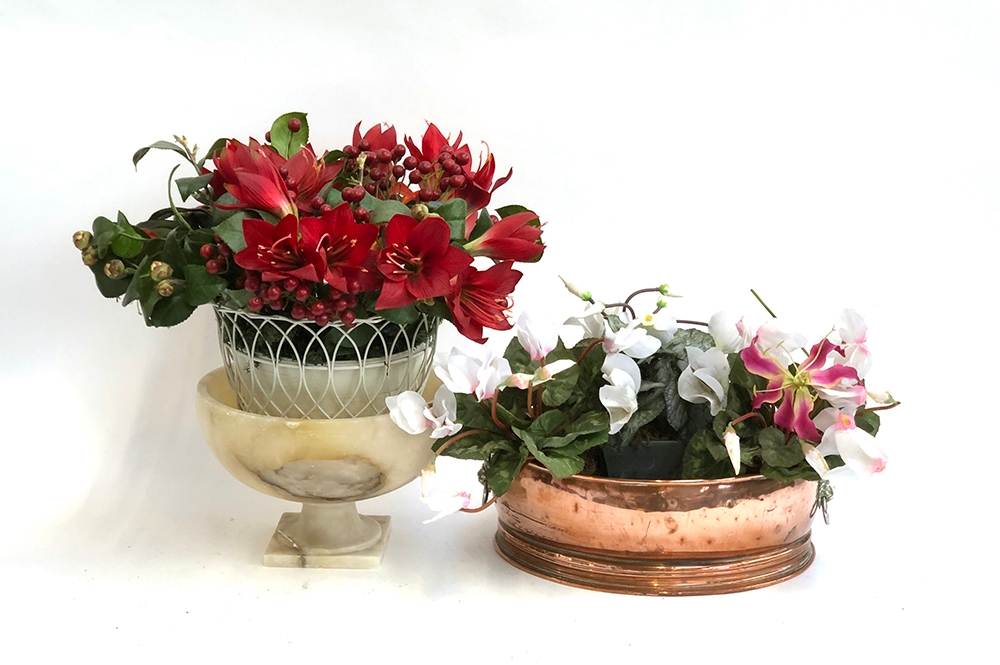 A twin handled copper planter and onyx footed bowl, with faux flowers