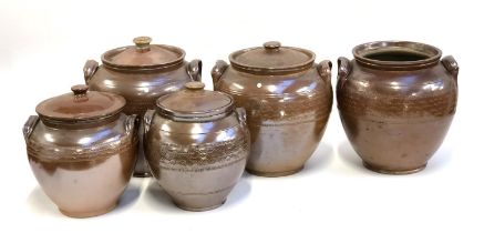 Five stoneware crocks, one missing lid, 23cmH to 28cmH