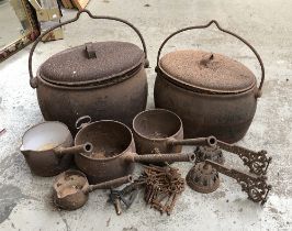 A lot of various cast iron pots and pans, the largest 50cmW