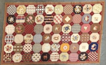 A needlework 'patchwork' style panel, 61x99cm