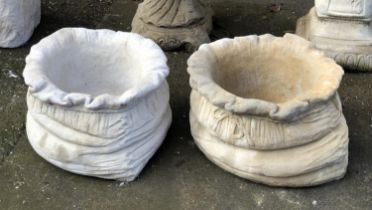 A pair of composite stone plant pots in the form of sacks, 25cmH