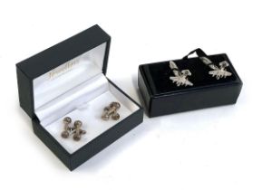 A pair of 925 silver dumbell shaped cufflinks; together with a further pair