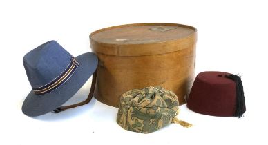 A Samson Riga vintage wooden hat box with travel stickers for Southern Railway, containing a